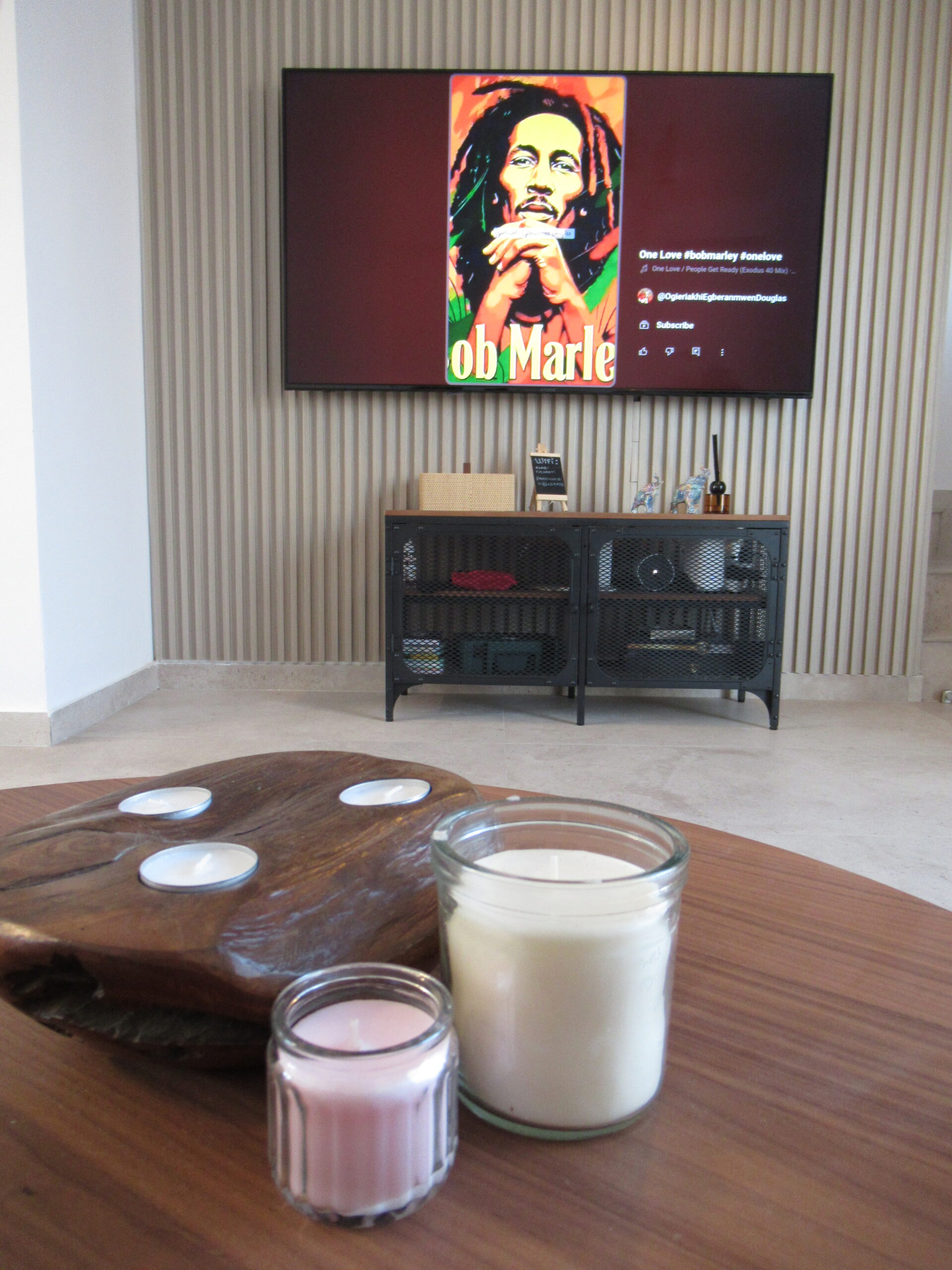 Cozy living room at Villa Kokona with TV and candles